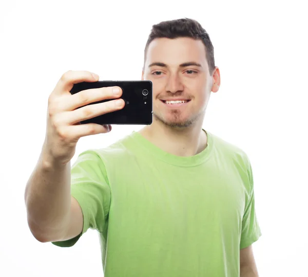 Young man making photo of himself — Stock Photo, Image