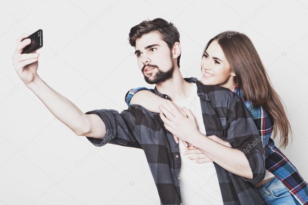 loving couple making selfie 
