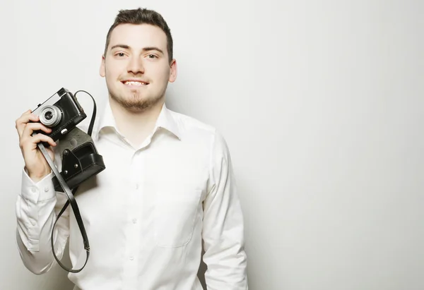 Young  photographer over white background — Stock Photo, Image