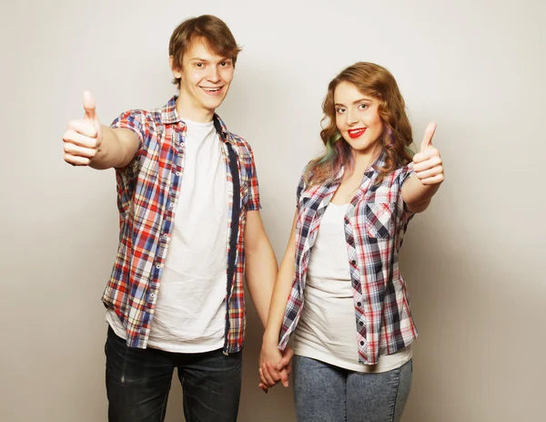 Lovely couple with thumbs-up gesture — Stock Photo, Image