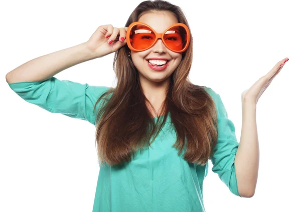 Playful young woman with party glasses. Ready for good time. — Stock Photo, Image