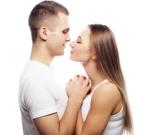 Lovely happy couple hugging over white background. — Stock Photo, Image