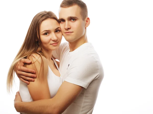 Lovely happy couple hugging over white background. — Stock Photo, Image