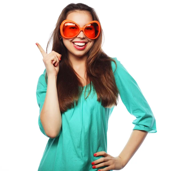 Playful young woman with party glasses. Ready for good time. — Stock Photo, Image