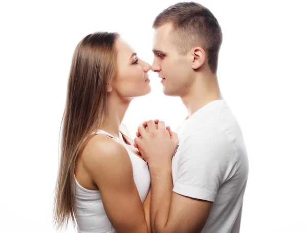 Lovely happy couple hugging over white background. — Stock Photo, Image