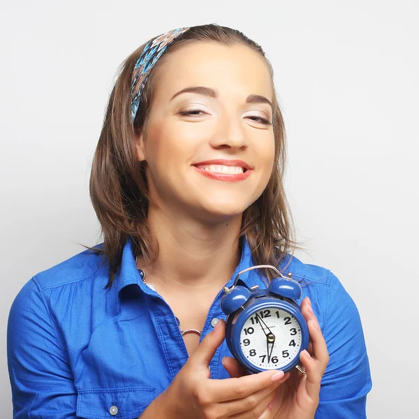 Young woman with alarmclock — Stock Photo, Image