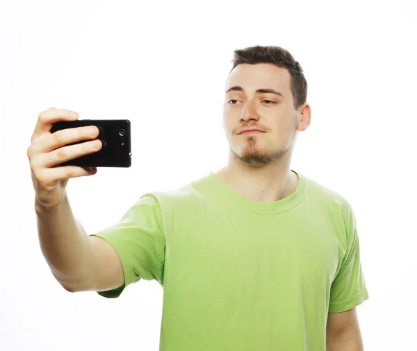 Young man making photo of himself — Stock Photo, Image