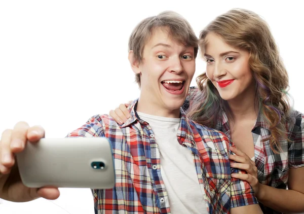 Smiling couple with smartphone, selfie and fun. — Stock Photo, Image