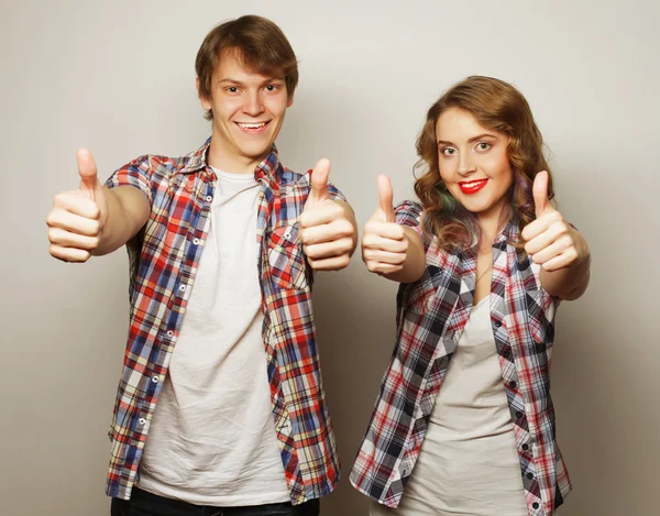 Lovely couple with thumbs-up gesture — Stock Photo, Image