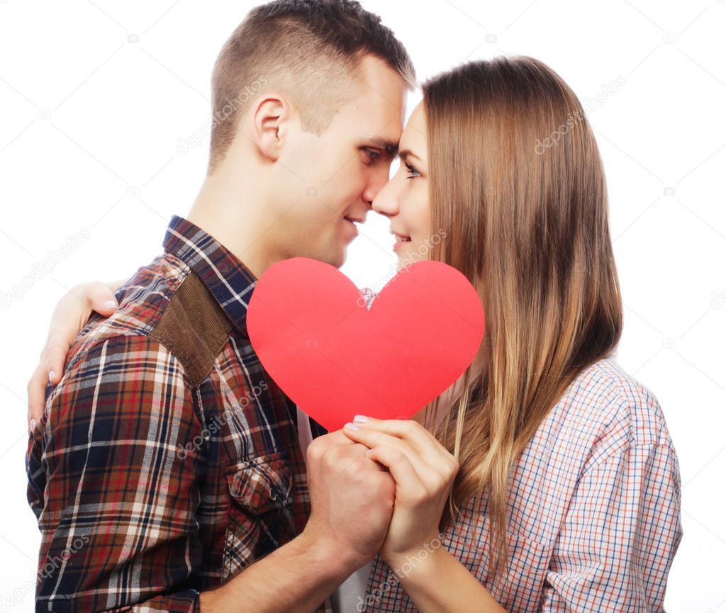 Happy couple in love holding red heart.