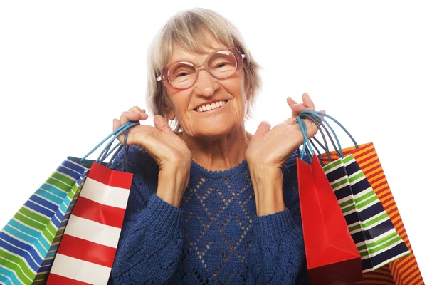 Szczęśliwa kobieta starszy z torby na zakupy — Zdjęcie stockowe