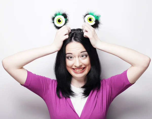 Beautiful young surprised woman with funny green eyes. — Stock Photo, Image