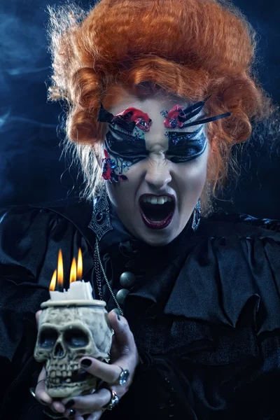 Beautiful fantasy woman with skull. Halloween theme. — Stock Photo, Image