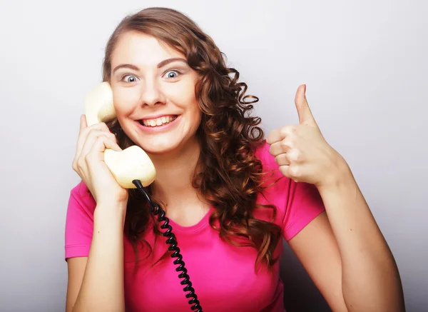 Young happy woman with vintage phone — Stock Photo, Image