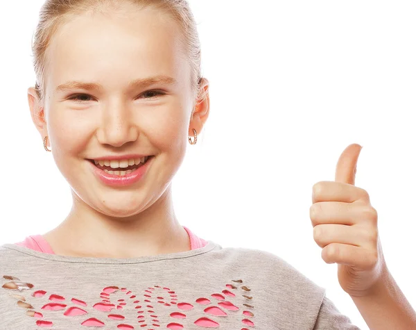 Гарненька школярка вказує свій індексний палець вгору в екстремі — стокове фото