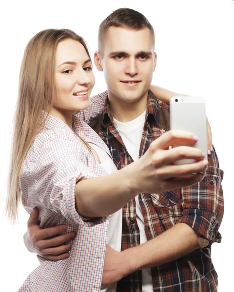 Smiling couple with smartphone, selfie and fun. — Stock Photo, Image