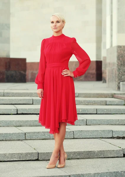 Happy beautiful woman in red summer dress — Stock Photo, Image