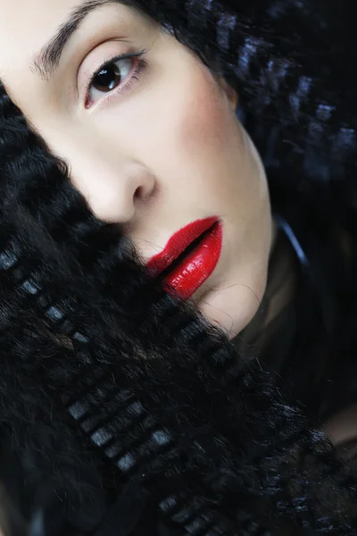 Young beautiful woman with curly hair and red lips — Stock Photo, Image