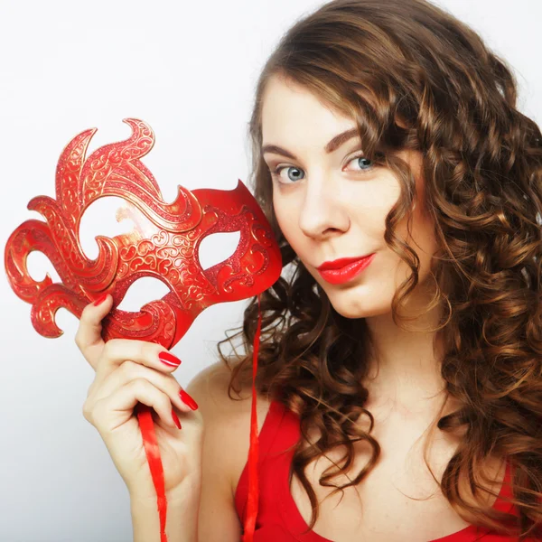 Young woman holding red mask — Stock Photo, Image