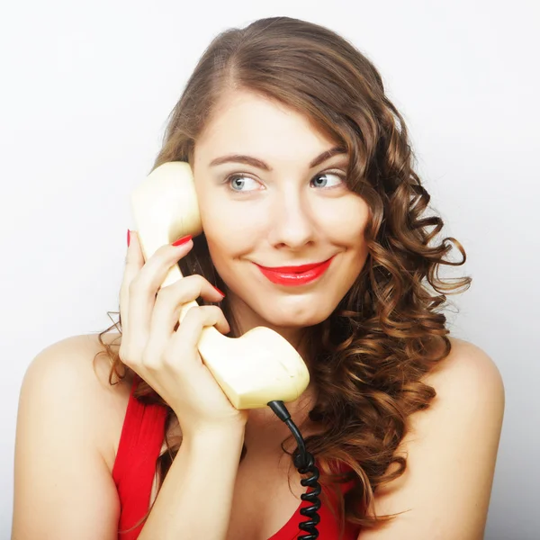 Mujer joven con teléfono vintage . —  Fotos de Stock