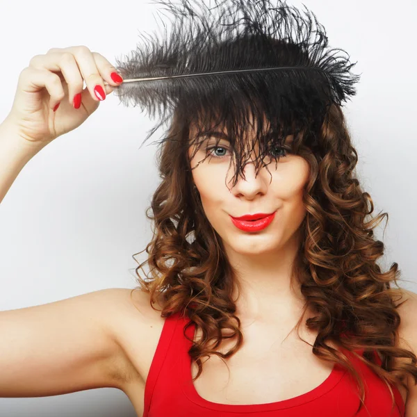 Casual woman with black  feather — Stock Photo, Image