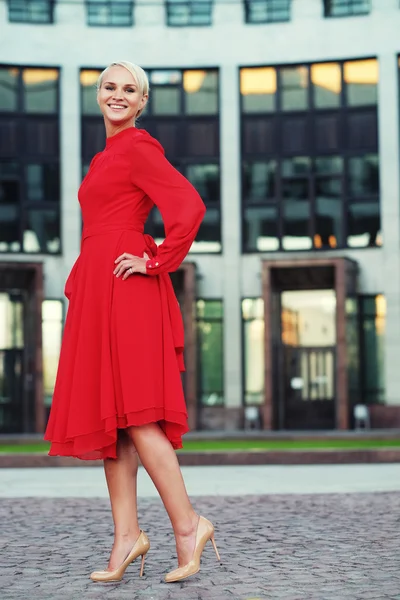 Happy beautiful woman in red summer dress — Stock Photo, Image