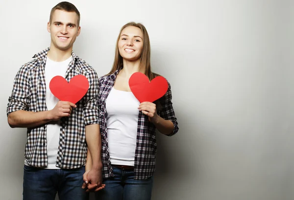 Happy couple in love holding red heart. — Stock Photo, Image