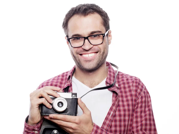 Young man with a retro camera — Stock Photo, Image