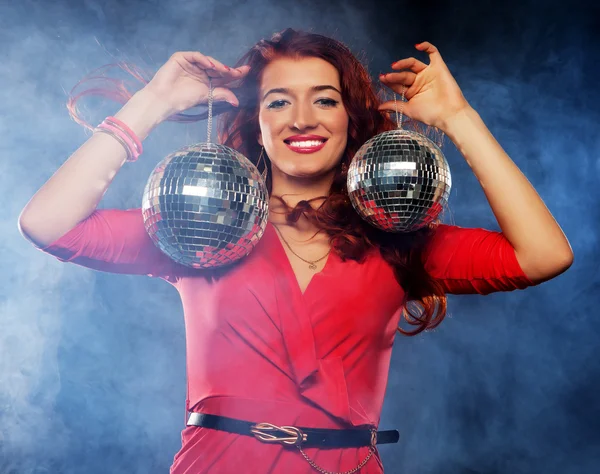 Woman holding disco balls at night club — Stock Photo, Image