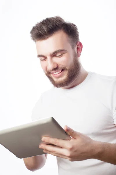 Young man  using a tablet computer — Stock Photo, Image