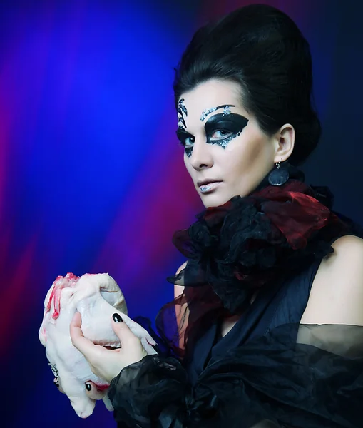 Halloween queen with chicken carcass — Stock Photo, Image