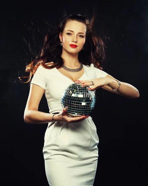 Young woman holding disco ball at night club — Stock Photo, Image