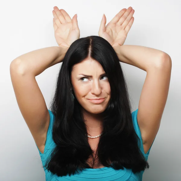 Funny woman doing hand sign. — Stock Photo, Image