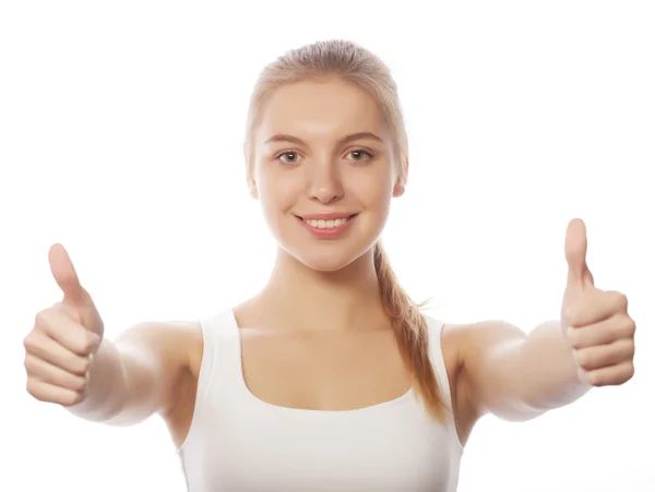 Happy smiling young woman with thumbs up gesture — Stock Photo, Image