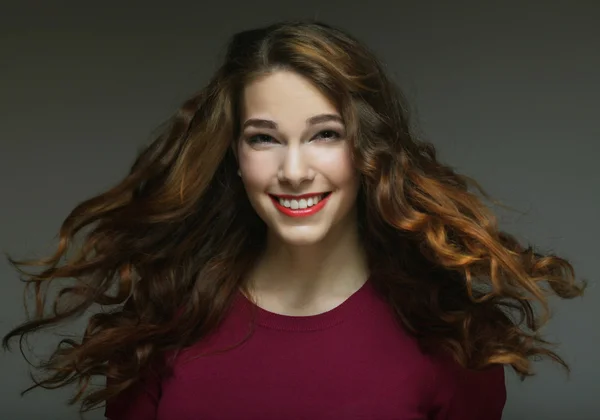 Young happy woman with wind in hair — Stock Photo, Image