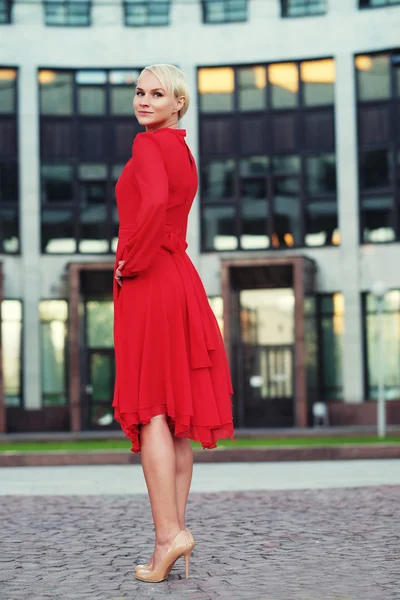 Happy beautiful woman in red summer dress — Stock Photo, Image