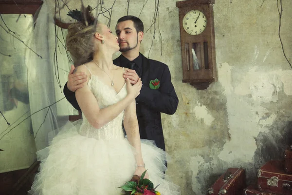 Bride and groom in vintage room