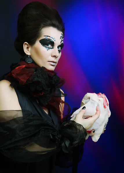 Halloween queen with chicken carcass — Stock Photo, Image