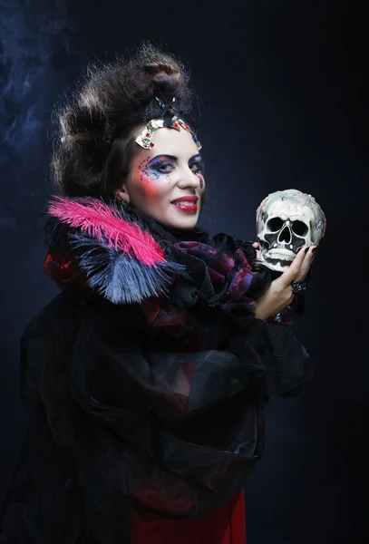 Fantasy woman with skull. Halloween theme. — Stock Photo, Image