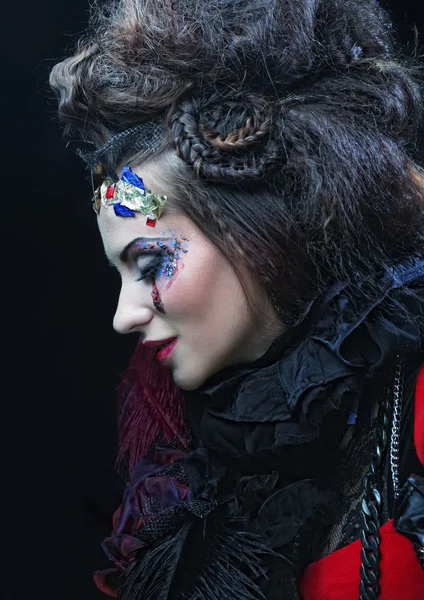 Portrait of woman with artistic make-up in blue smoke — Stock Photo, Image