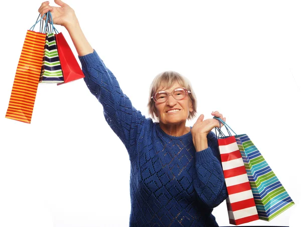 Szczęśliwa kobieta starszy z torby na zakupy — Zdjęcie stockowe