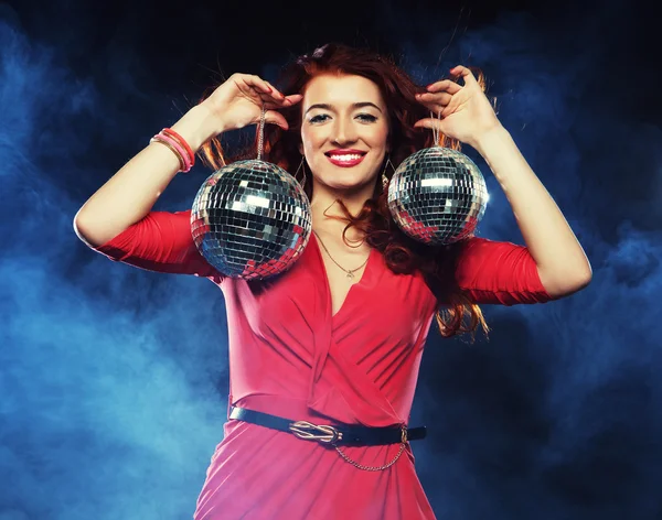 Woman holding disco balls at night club — Stock Photo, Image