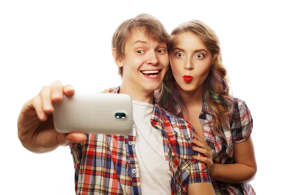 Smiling couple with smartphone, selfie and fun. — Stock Photo, Image