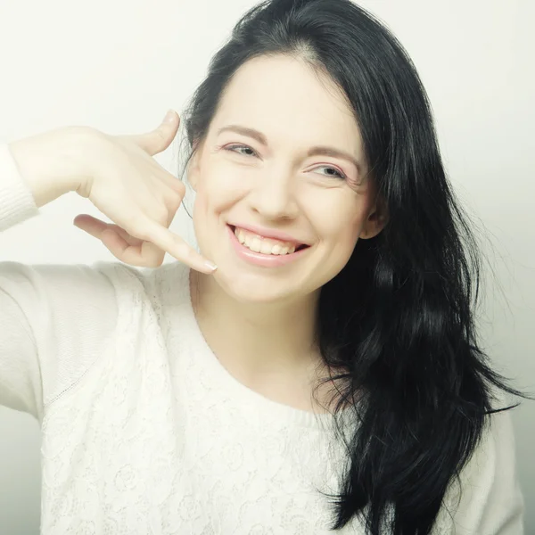 Happy woman making a call me gesture — Stock Photo, Image