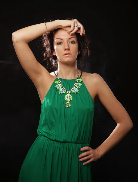 Beautiful woman in green dress — Stock Photo, Image