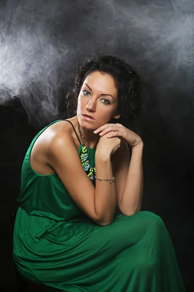 Beautiful woman in green dress — Stock Photo, Image