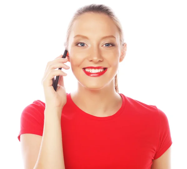 Woman using a mobile phone isolated on a white background — Stock Photo, Image