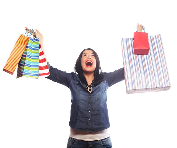 Gelukkig brunette vrouw met shopping tassen — Stockfoto