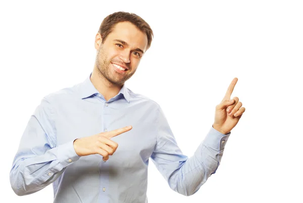 Young smiling happy man shows something — Stock Photo, Image