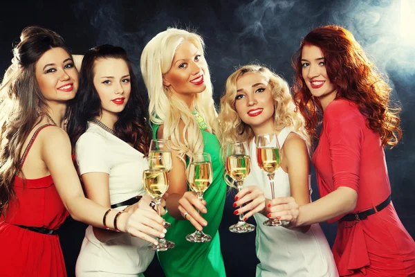 Girls clinking flutes with sparkling wine — Stock Photo, Image